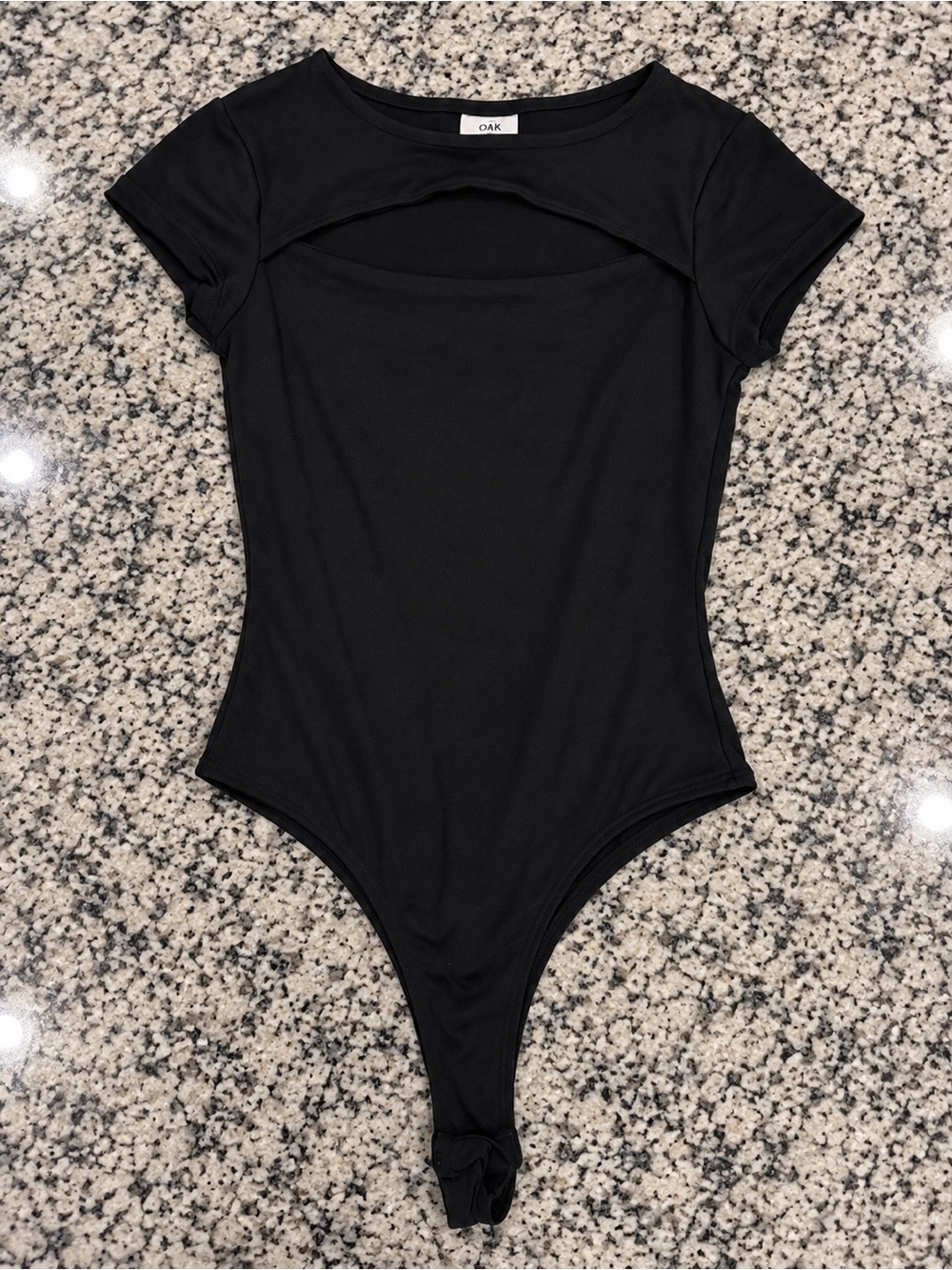 Rue21 Black Short-Sleeve One-Piece Bodysuit with Front Cutout